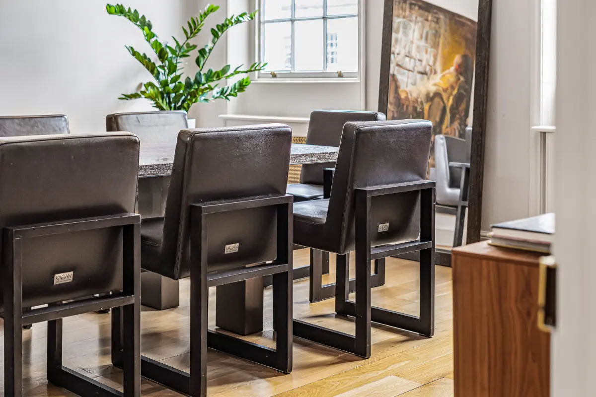 Close-up of the chic dining chairs at Casa Cribs blending comfort and style.
