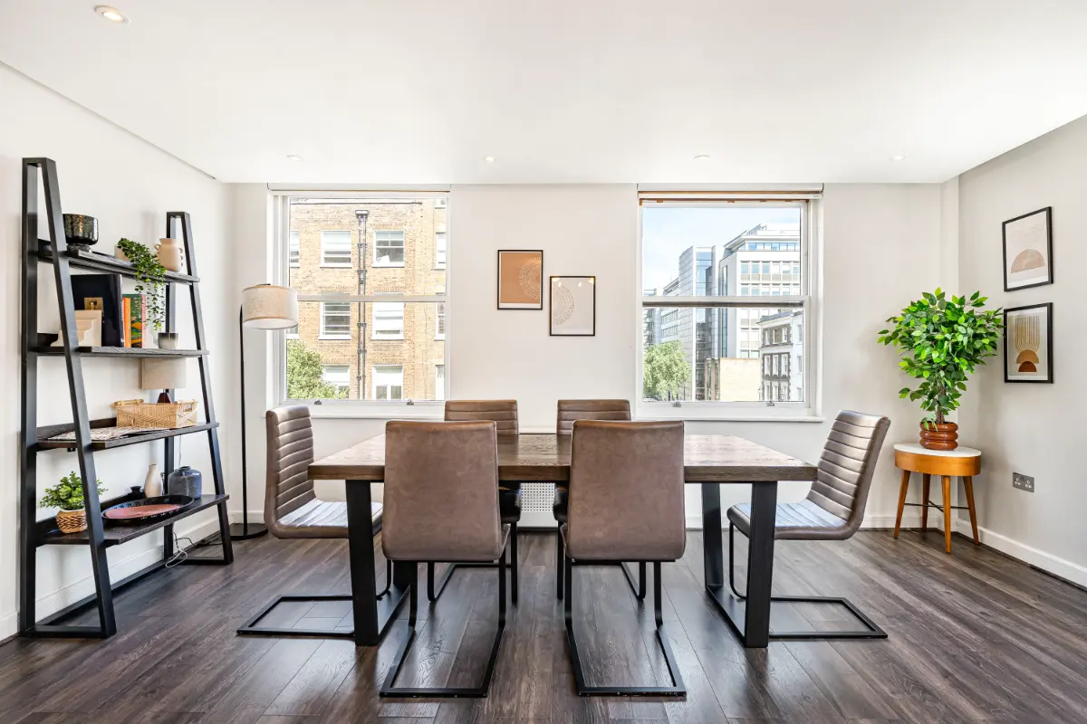 	Dining area at Casa Cribs with a contemporary table and comfortable chairs.