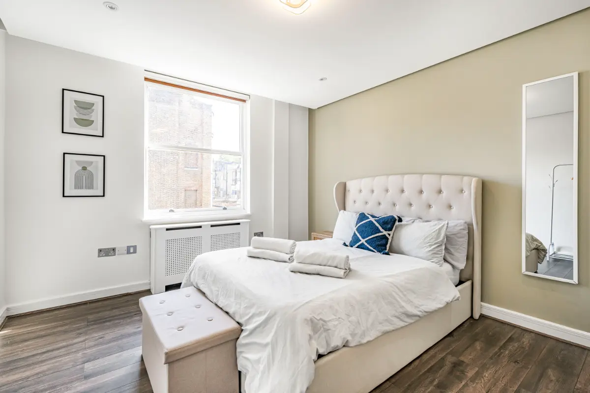 	Queen bedroom at Casa Cribs with a cozy atmosphere and ample storage.