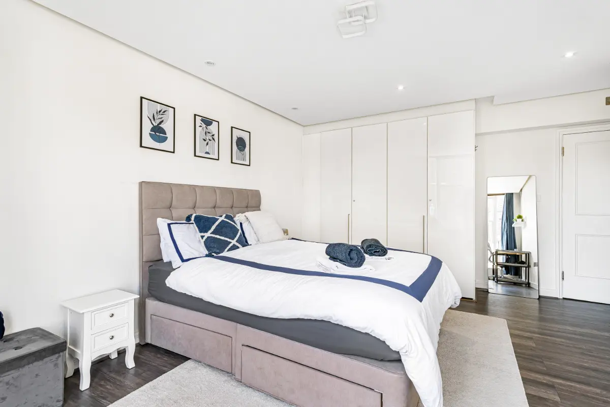 	Another angle of the elegant bedroom at Casa Cribs with luxurious bedding and natural light.