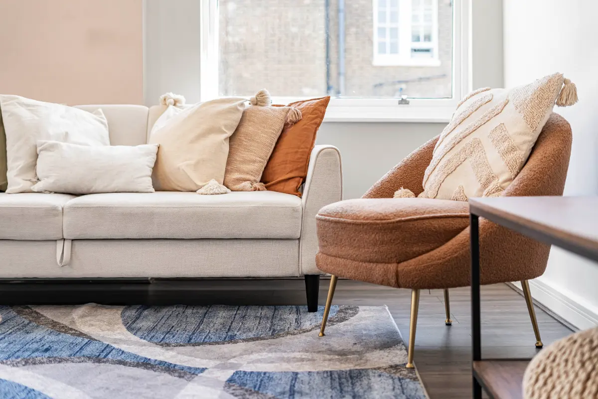 Close-up of the comfortable sofa in the living room at Casa Cribs with stylish throw pillows.