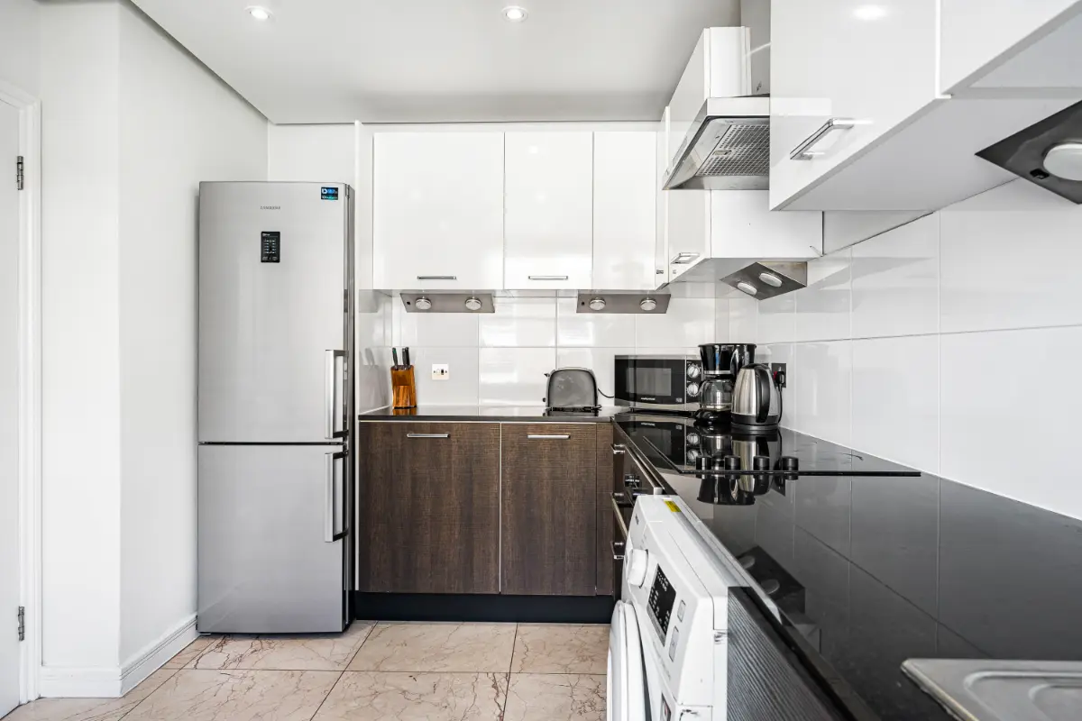 Spacious kitchen at Casa Cribs featuring ample counter space and modern amenities.