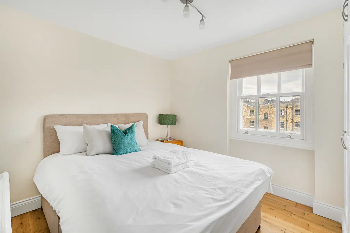 Peaceful bedroom at Casa Cribs with premium linens and storage.