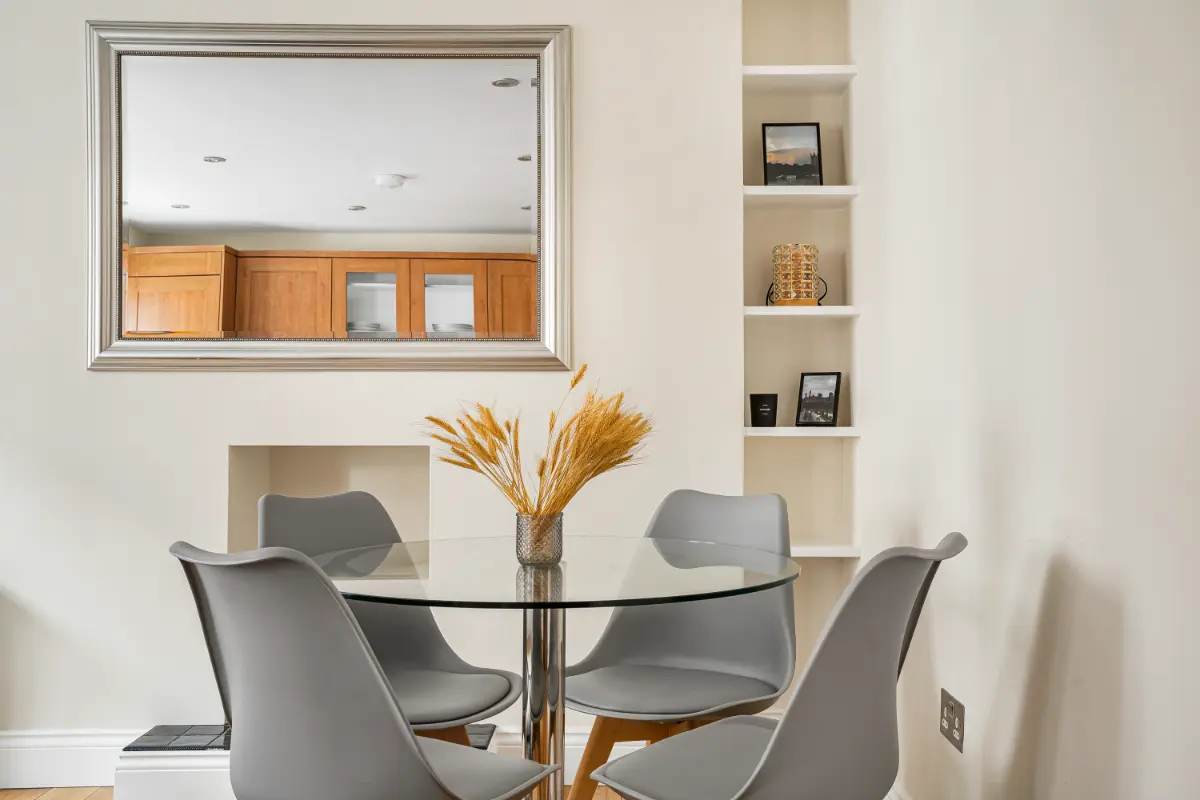 Elegant dining area at Casa Cribs with a wooden table and modern chairs