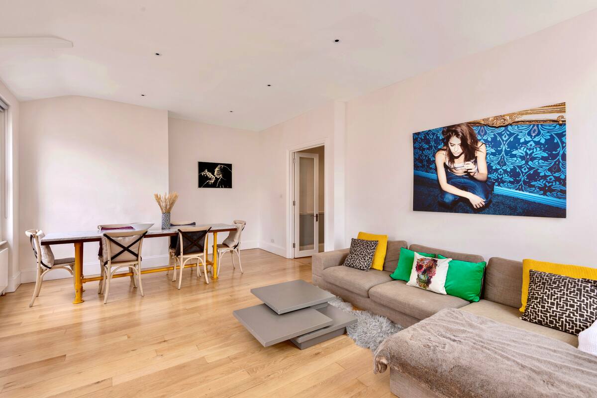 Another angle of the stylish living area at Casa Cribs with ample natural light.