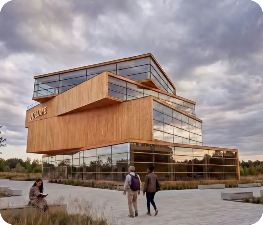 Two people walking in front of a building.