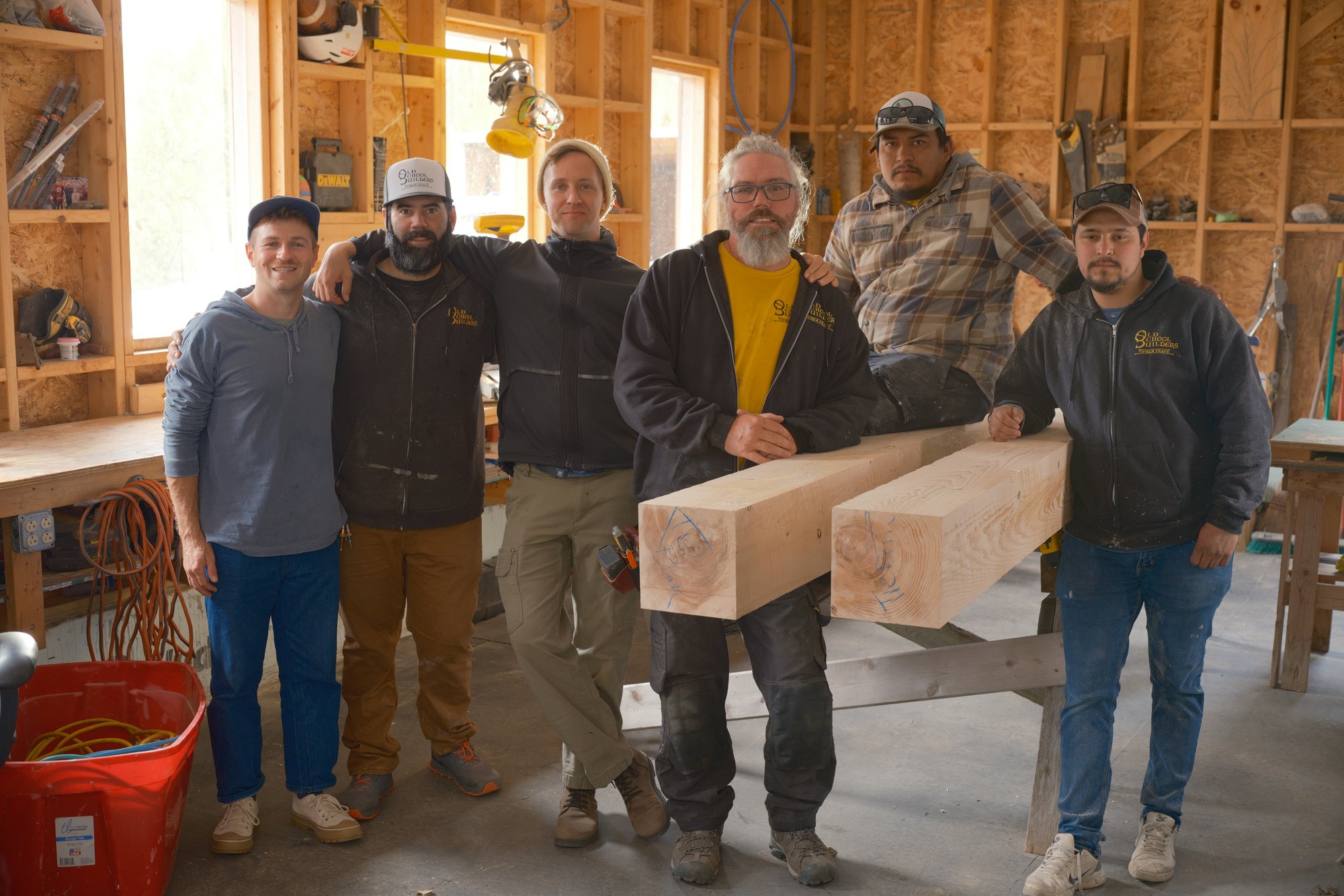 Kingdom Sun's Vermont crew standing amongst freshly cut and stained Sunport timbers