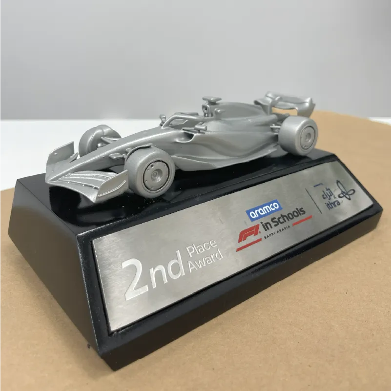 Silver model of a Formula 1 racing car on a black base labeled 2nd Place Award for F1 in Schools Saudi Arabia.