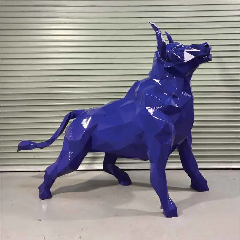 Glossy blue geometric bull sculpture with angular facets standing on concrete floor.