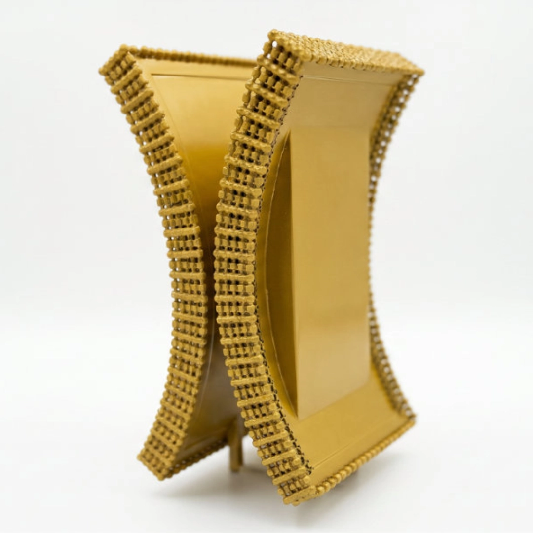 Gold award piece with beaded edge detailing and a polished finish