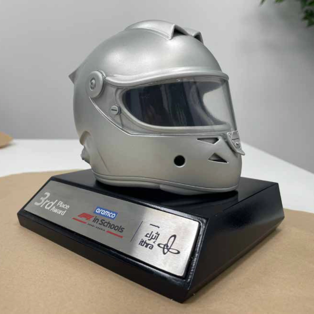Silver racing helmet trophy on a black base with a 3rd Place Award plaque and logos.