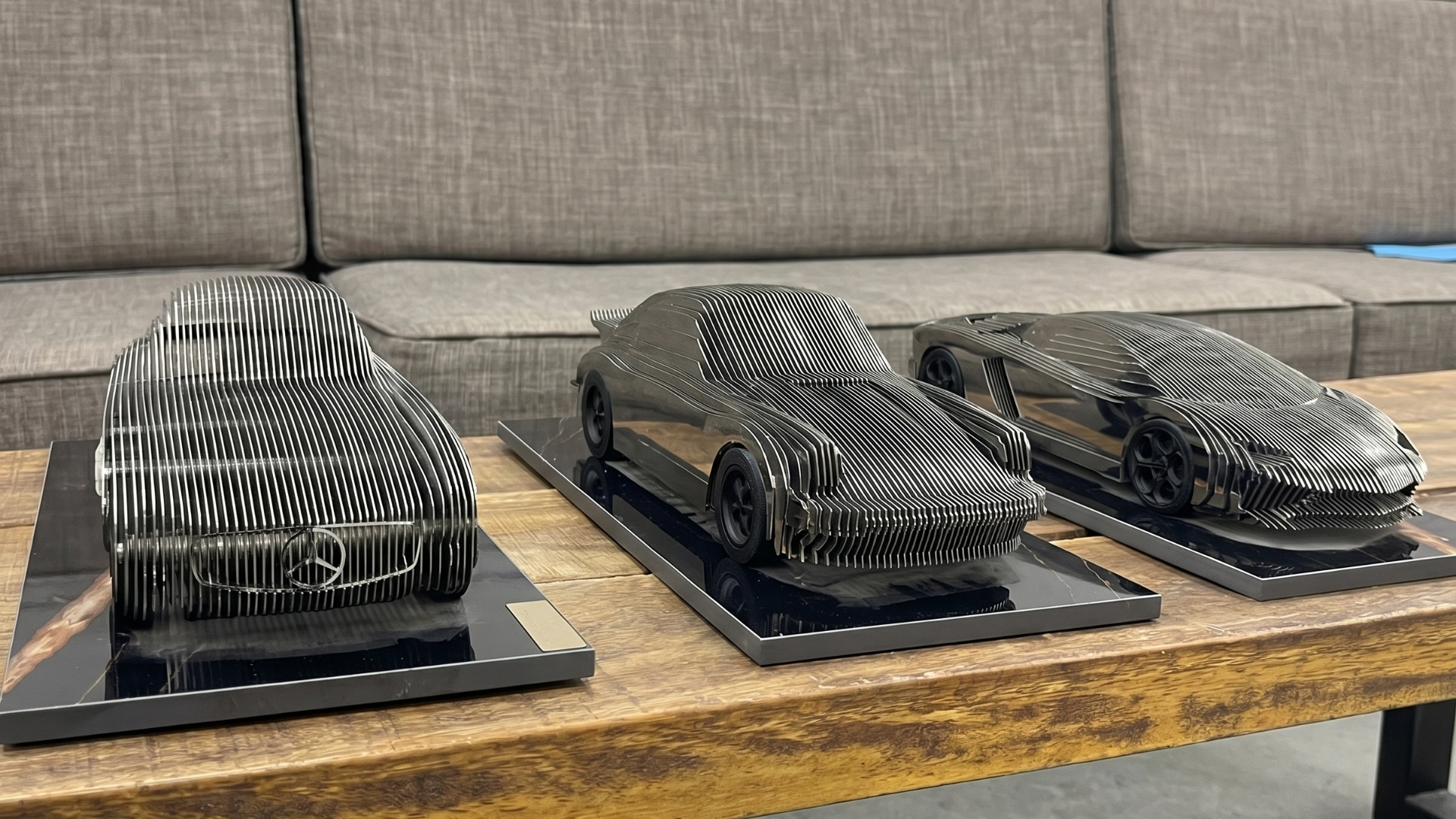 Chrome-effect car sculpture with a mirror-like metallic finish