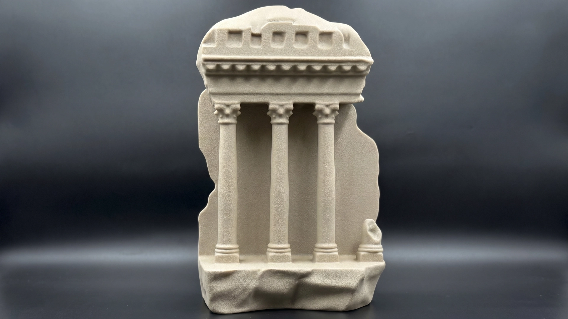 Carved replica of an ancient rock-cut facade.