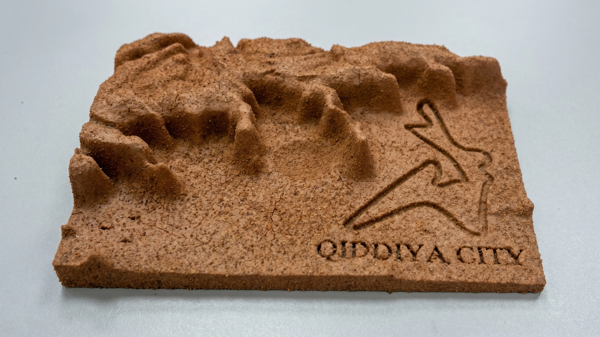 Detailed presentation model of a large development with sculpted rocky terrain