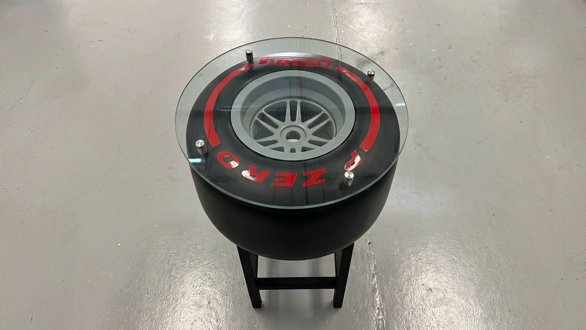 Custom table built on a tyre base with a fitted top.