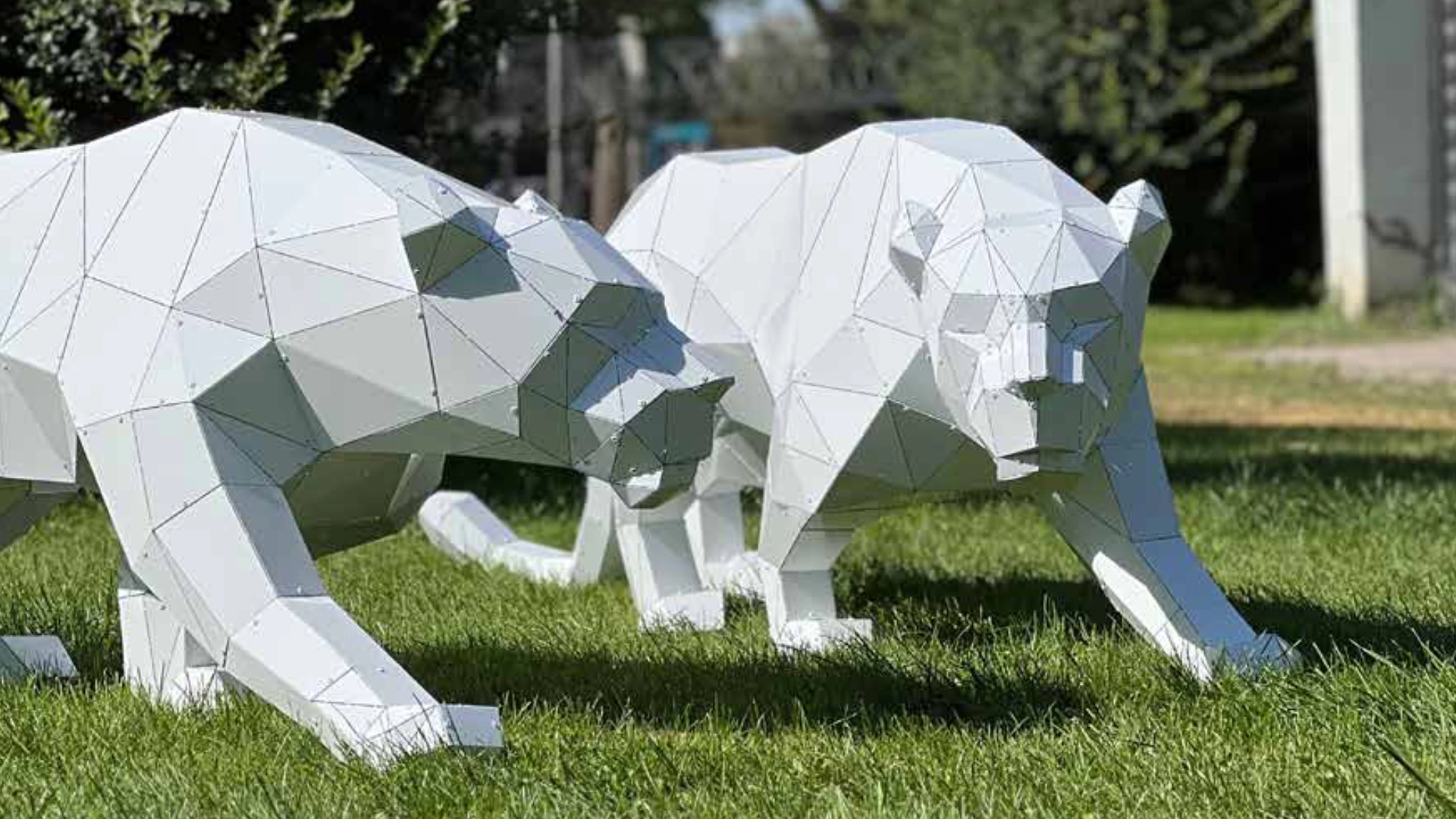 Sleek white panther sculpture with a seamless finish