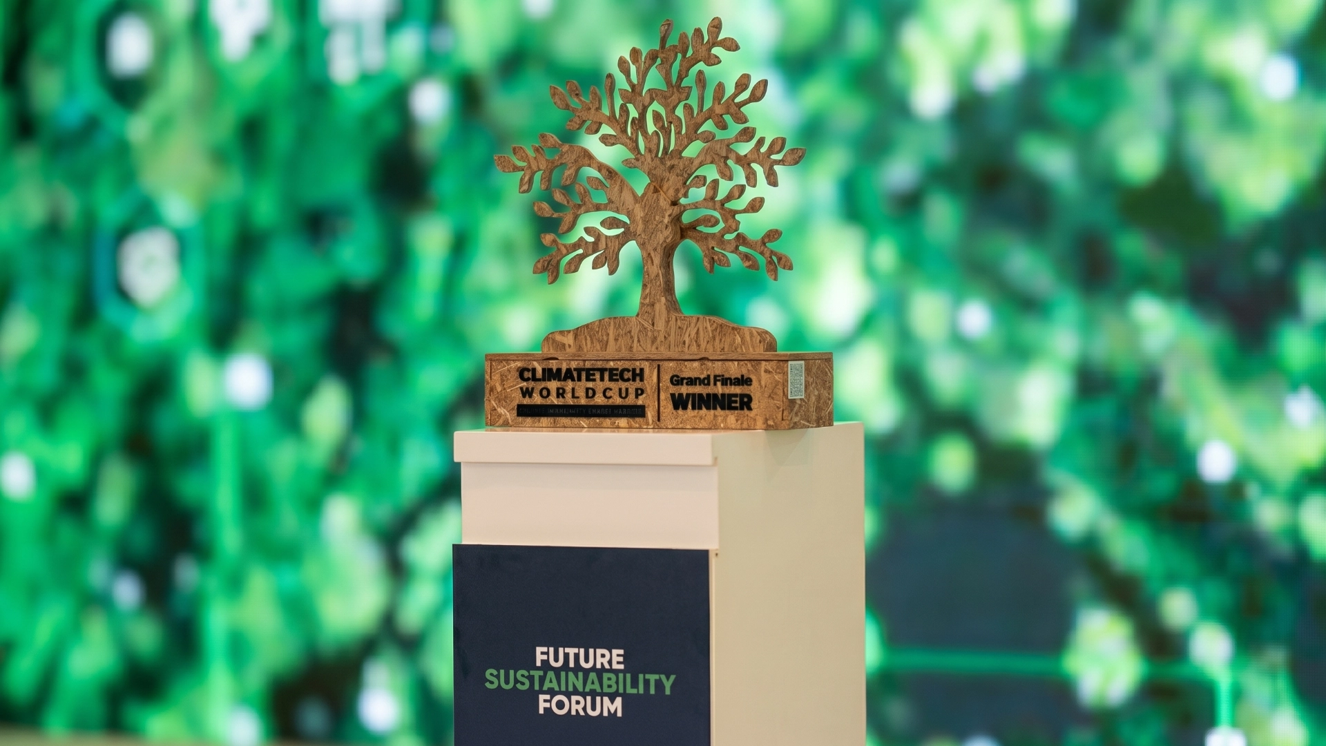 Recycled plastic tree trophy on a plinth