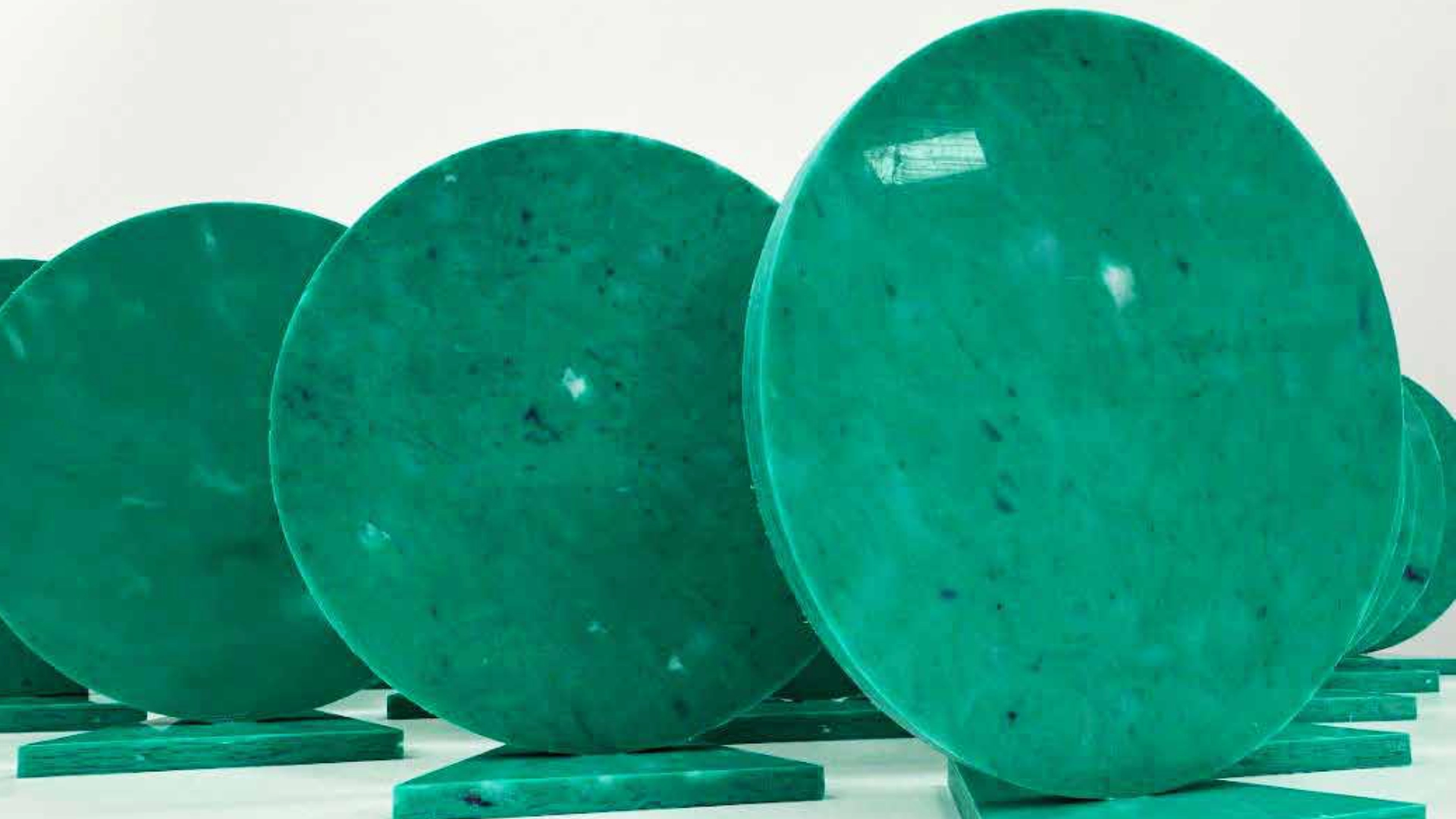 Recycled discs standing upright on pressed bases