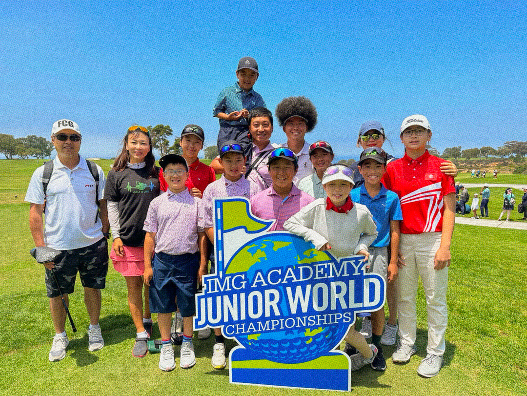 Students and instructors posing next to a sign that says: IMG Academy Junior World Championships