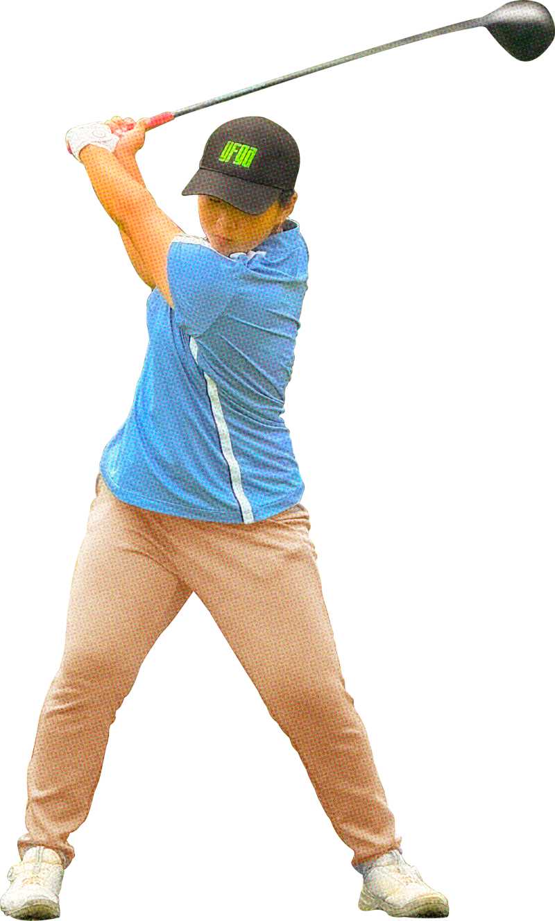 A girl swinging a golf club