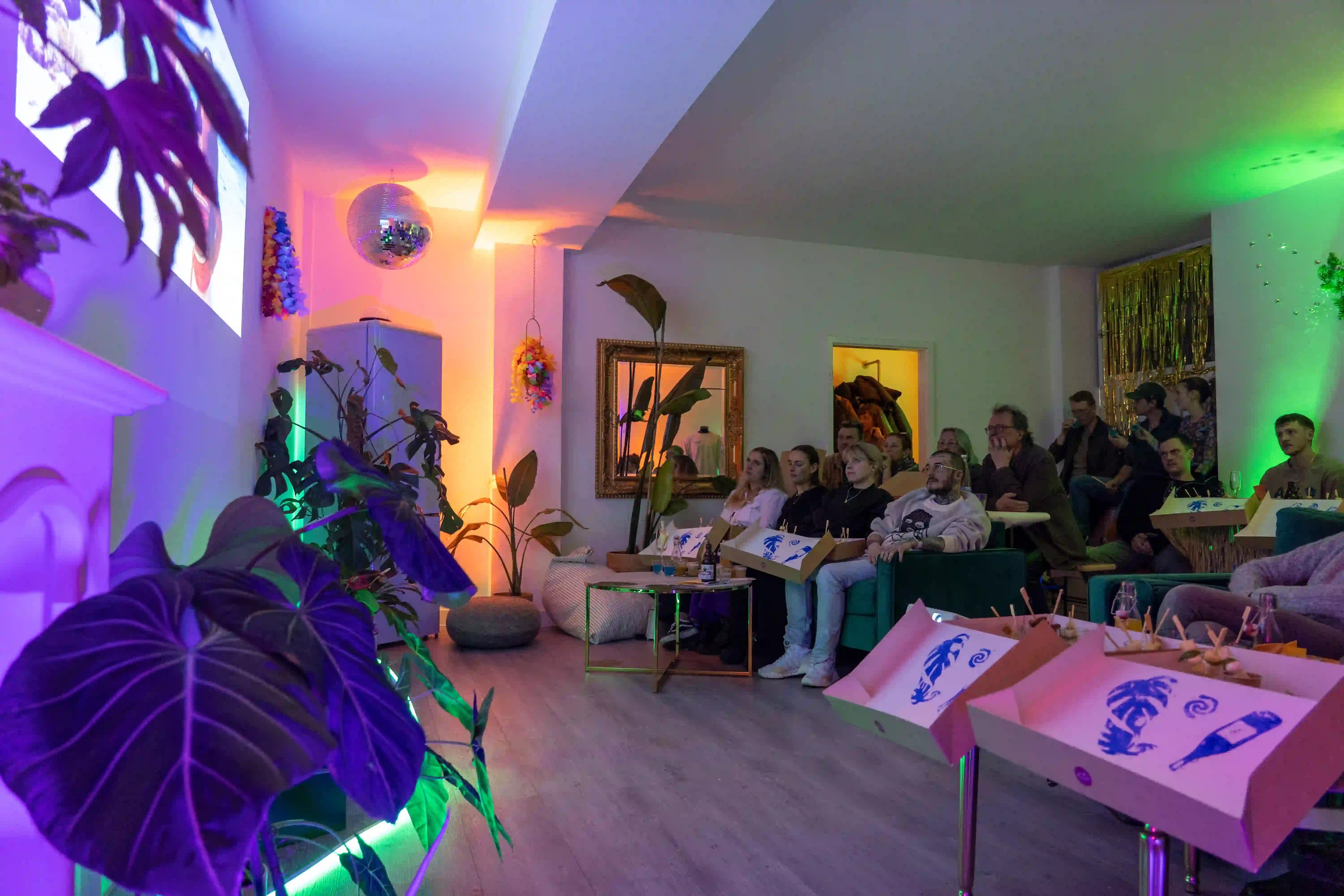 Person aiming a dart at a dartboard with a projected sign that says 'Dartturnier' and images of darts in the background.