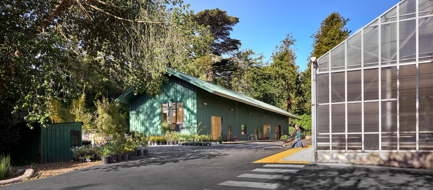 San Francisco Botanical Gardens greenhouse architecture showing visitors engaging with botanical collections in controlled environment facilities