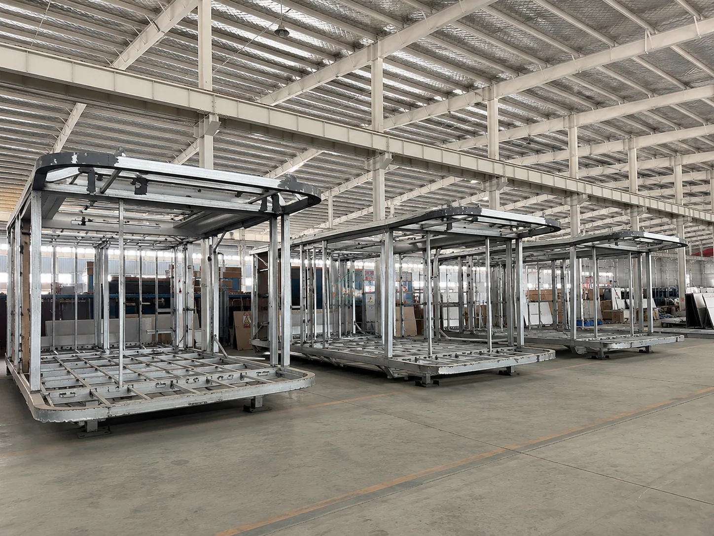 Steel capsule frames on assembly jigs in the Dakeeta factory