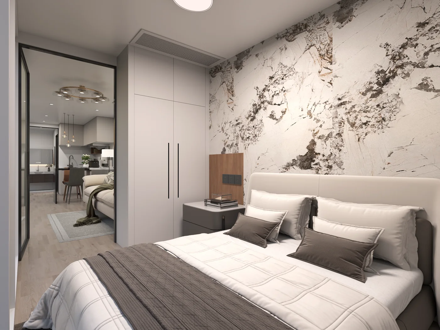 Marble-look feature wall behind the bed with fitted wardrobe alongside