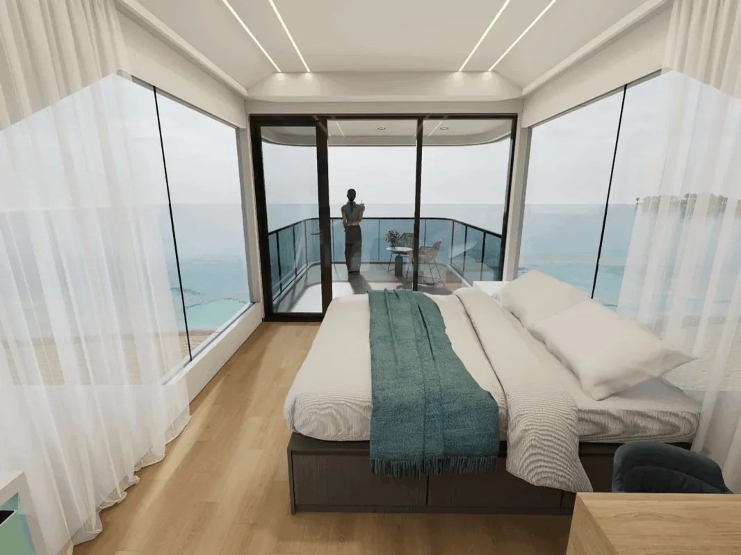 The Wimberley 800 upper bedroom, sheer curtains drawn back to the balcony