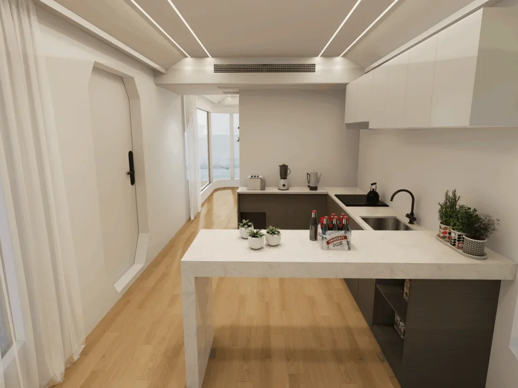 The Wimberley 800 kitchen, timber floor and sea light through the glazed elevation