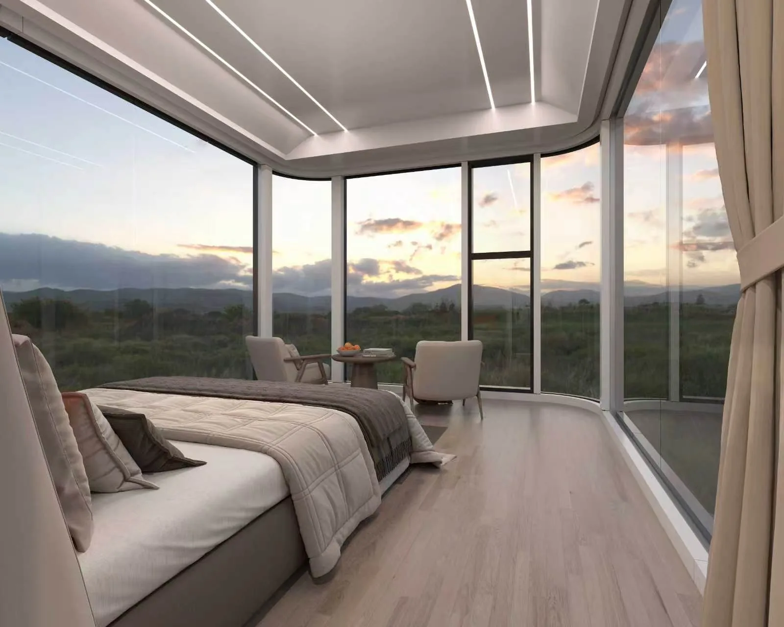 The Marfa 200 interior at dusk, bed and seating along the panoramic glass