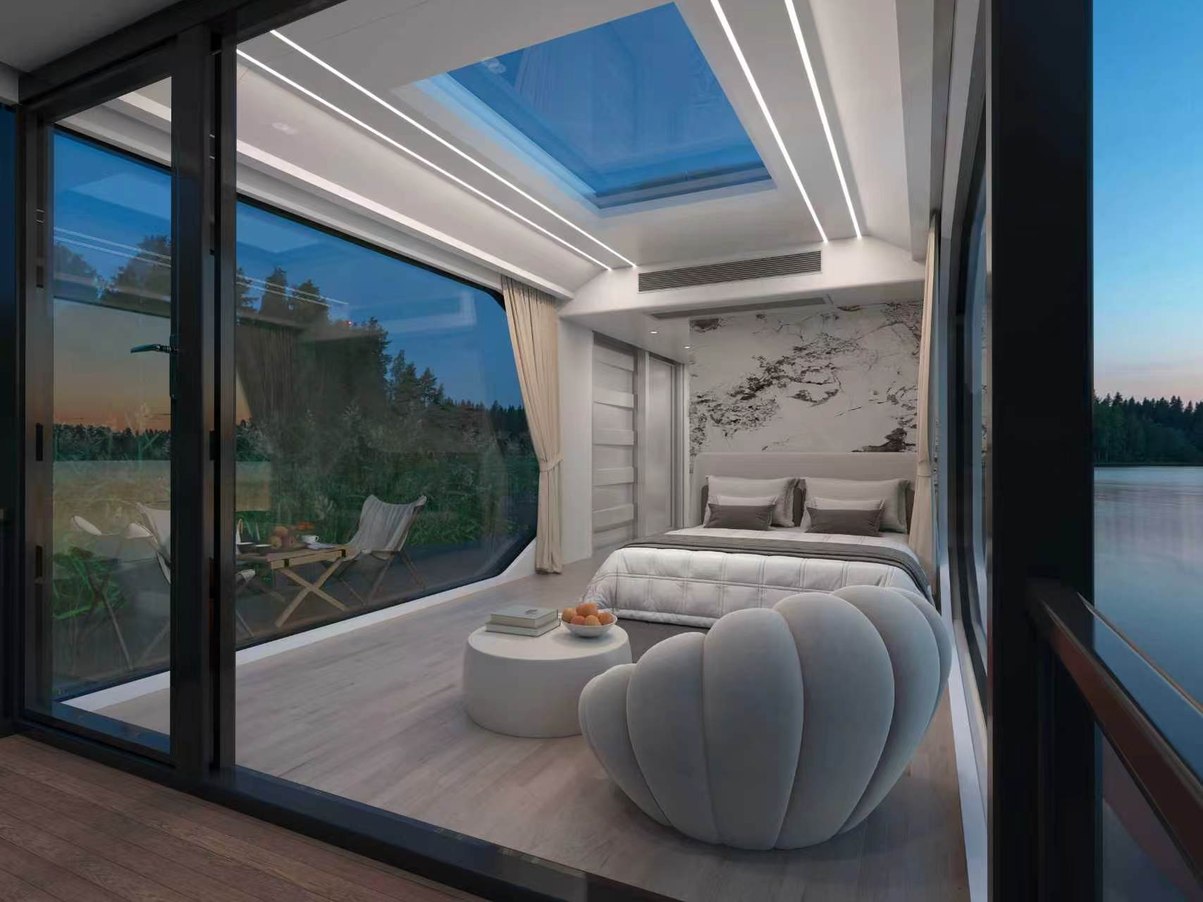The Barton Springs 410 bedroom, glazing on two sides opening onto the water
