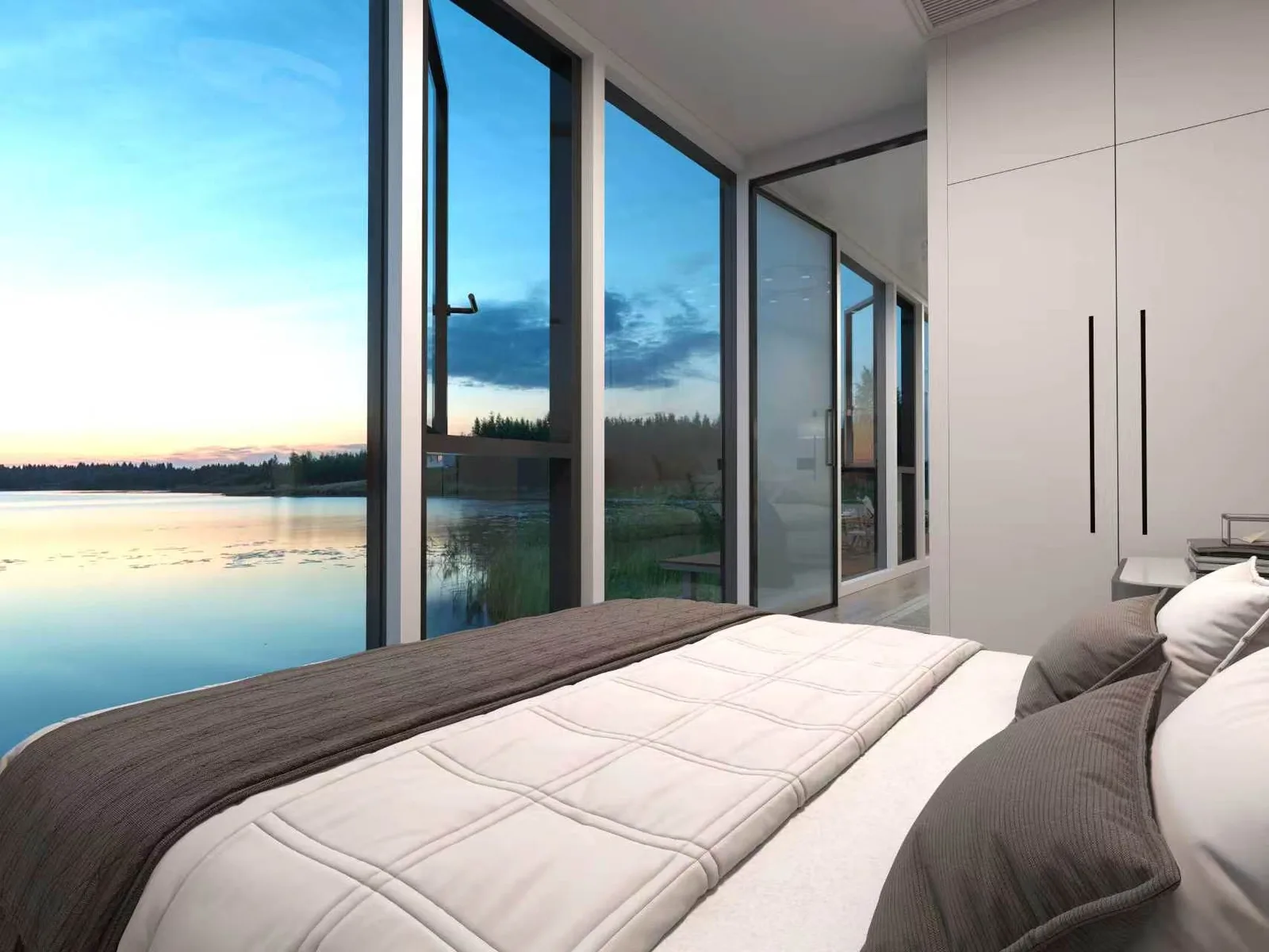The Austin 280 bedroom at sunset, glazing opening onto still water