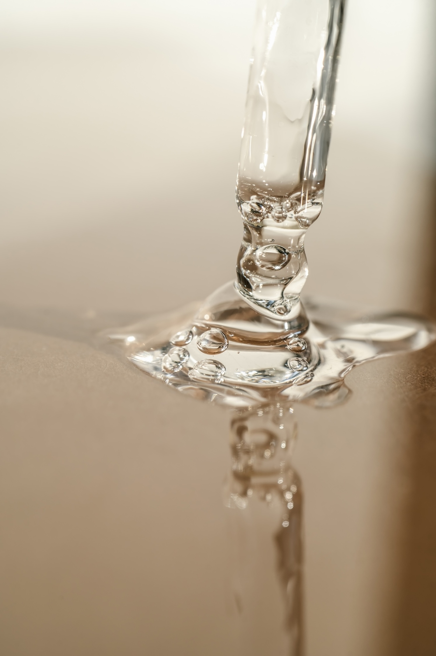 Close-up of clear water droplets splashing and forming intricate liquid patterns