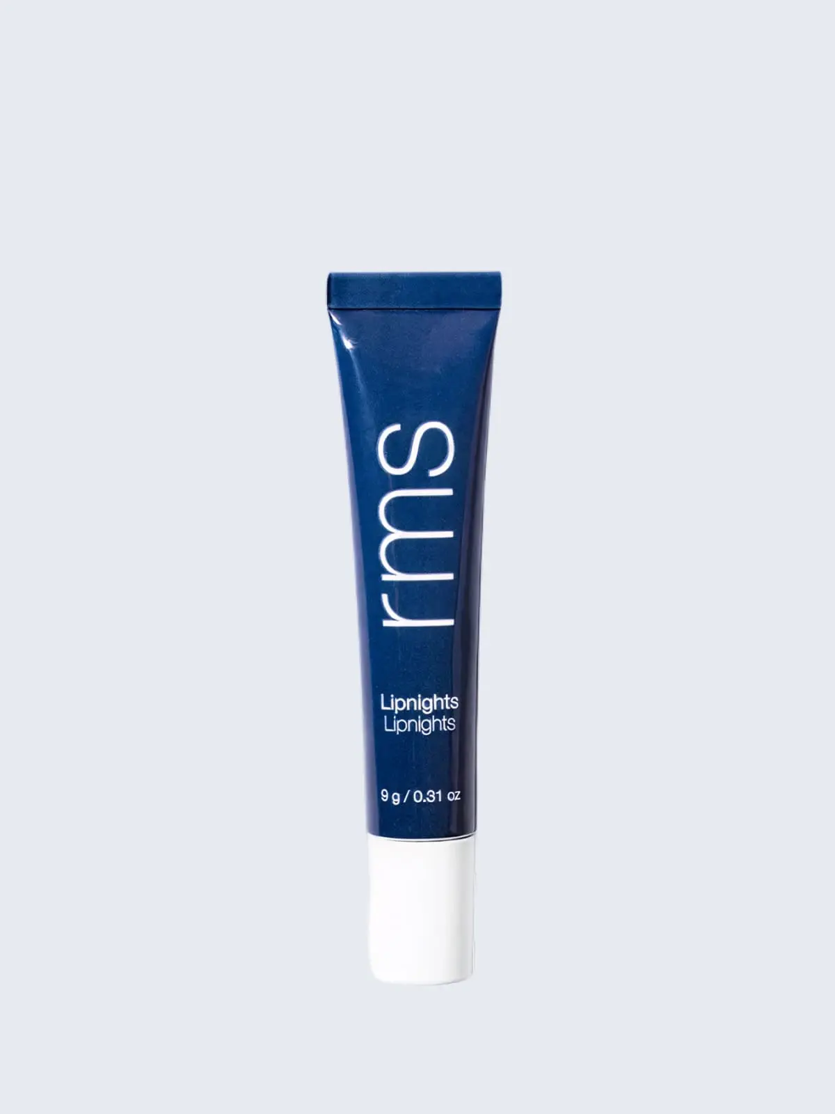 Navy blue RMS Lipnights lip product in tube packaging