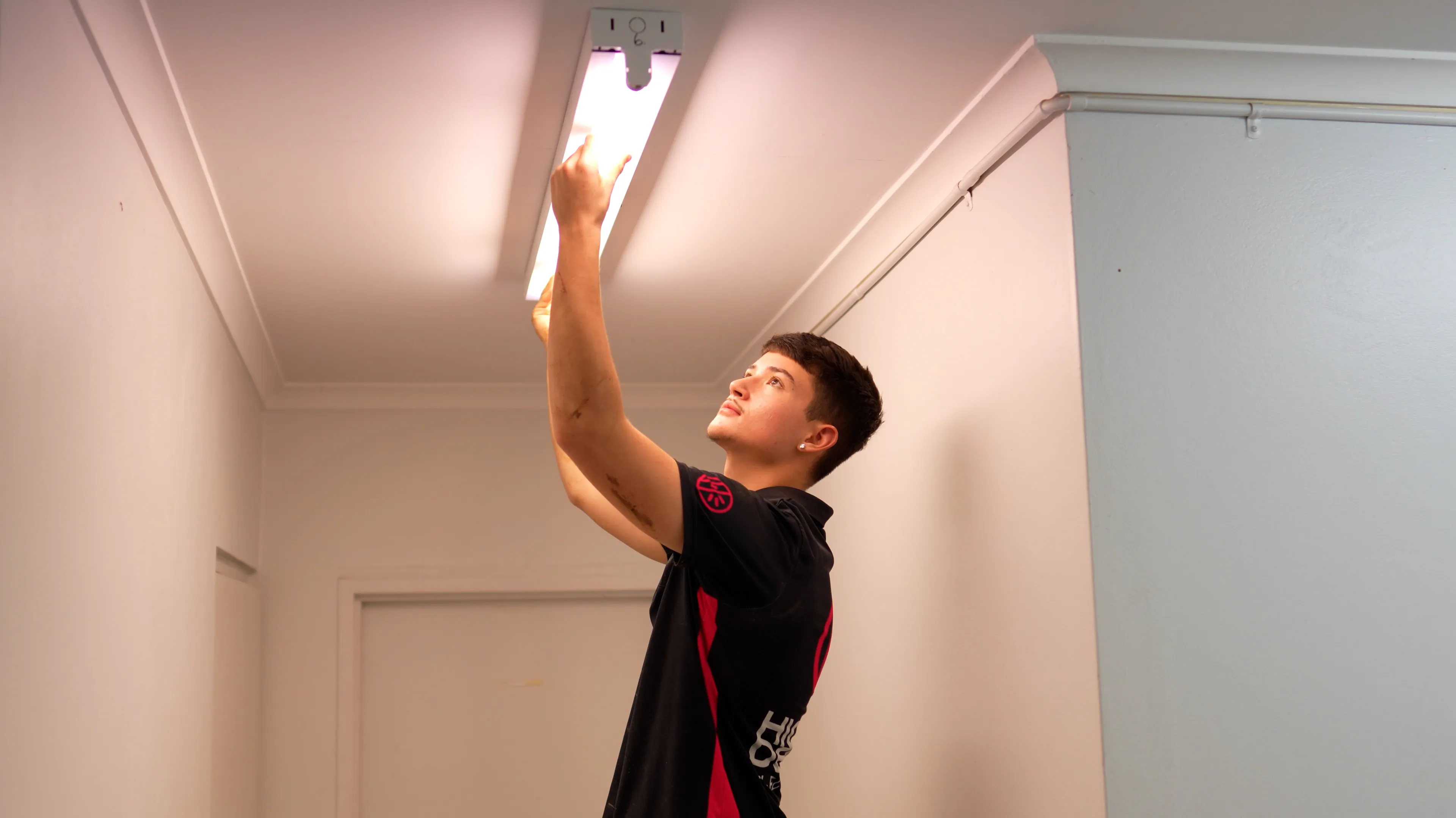 Level 2 electrician reconnecting power supply at a residential meter box in NSW
