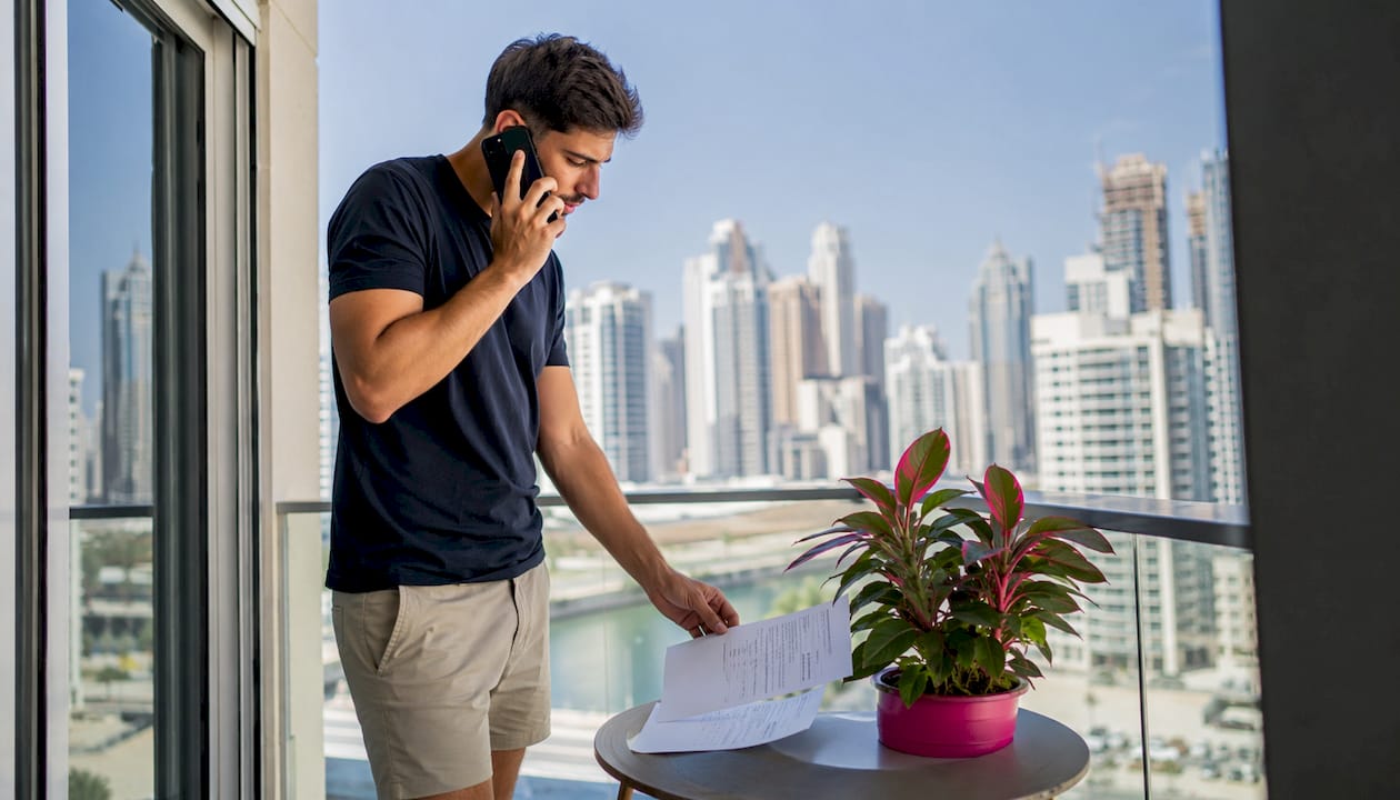 Man calling electricity distributor at home