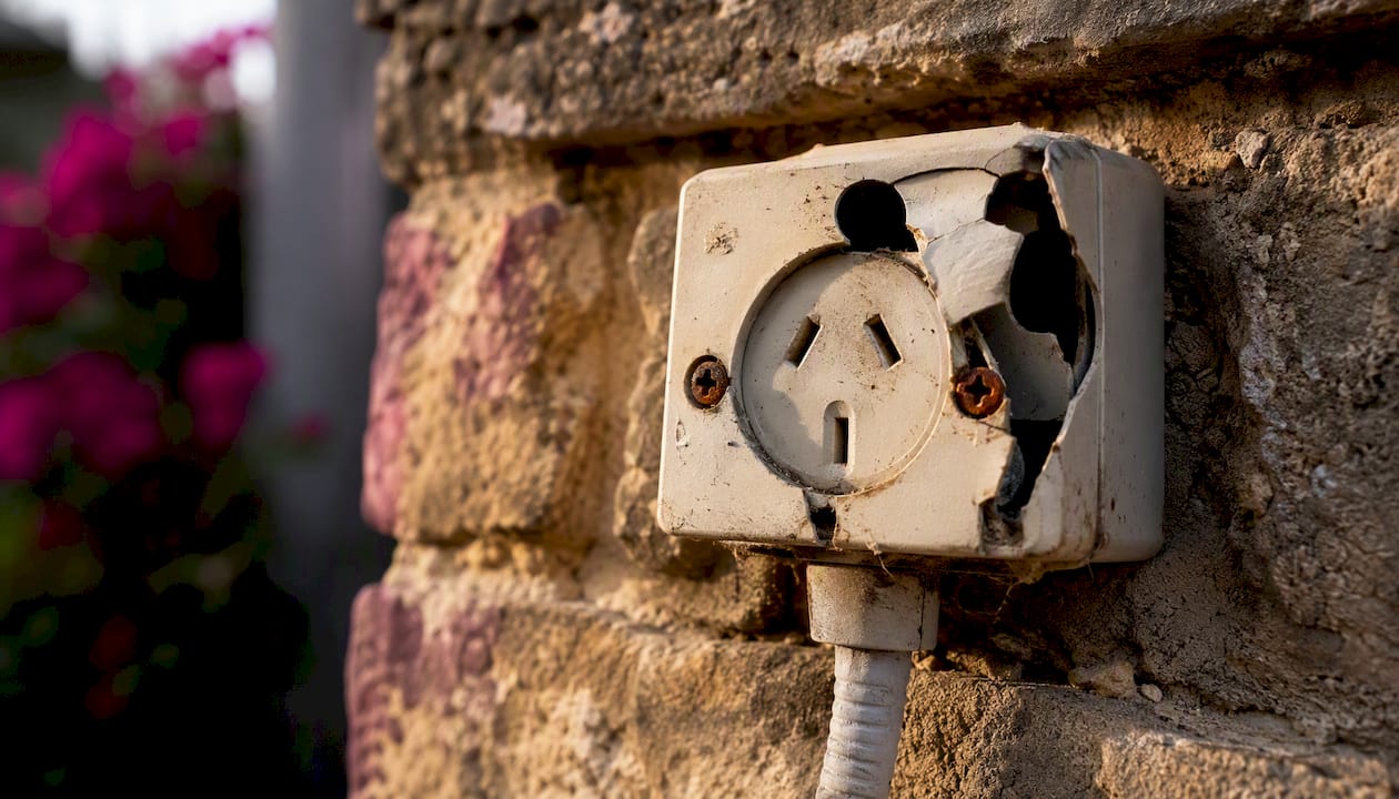 Outdoor power outlet with weather damage