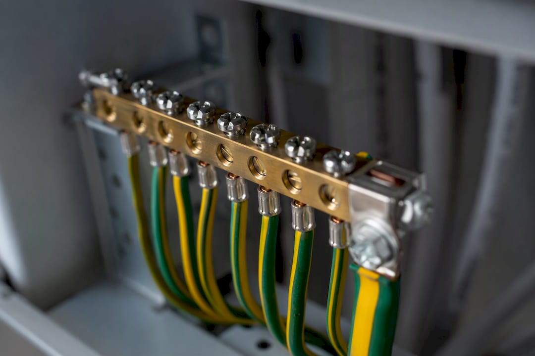 Close-up of switchboard earth bar wiring and bonding