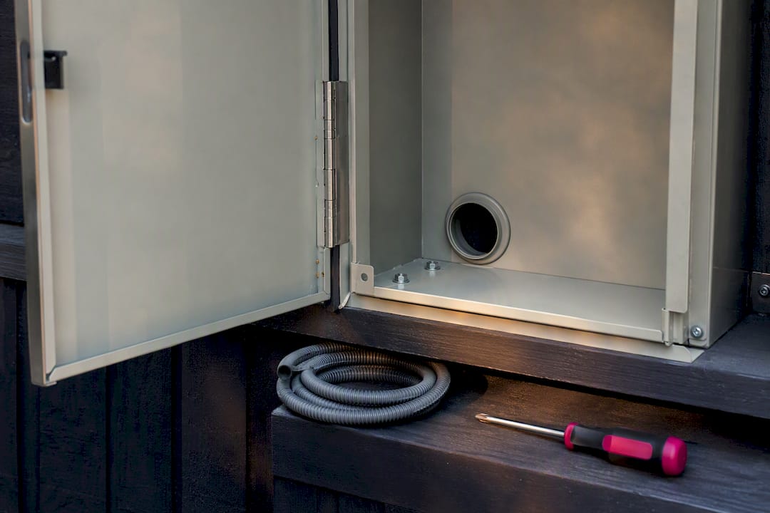 Meter enclosure hinge and spare conduit detail