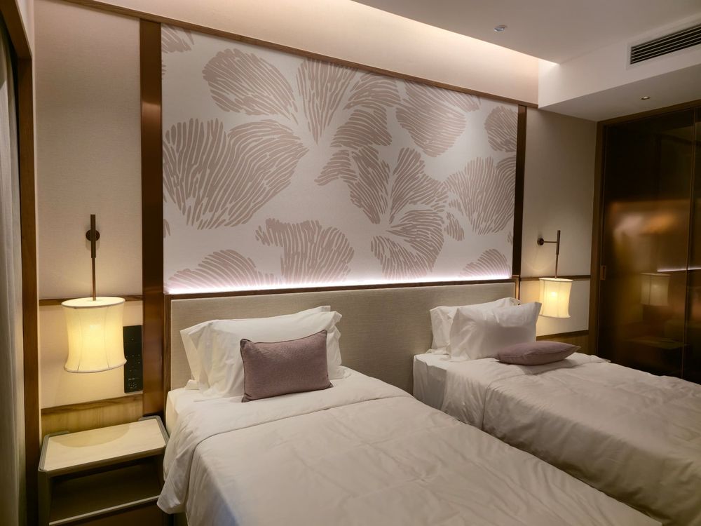 Twin bedroom with printed headboard
