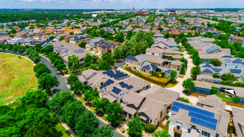 overview of a neighborhood with solar paneled houses
