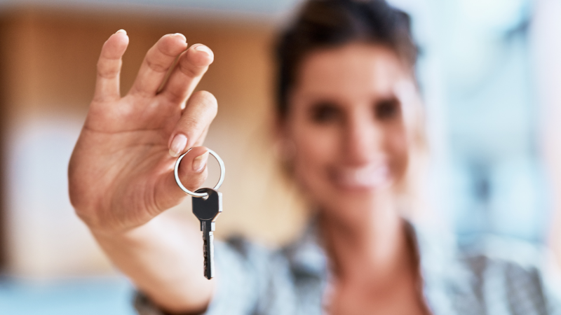 blurred lady holding a house key