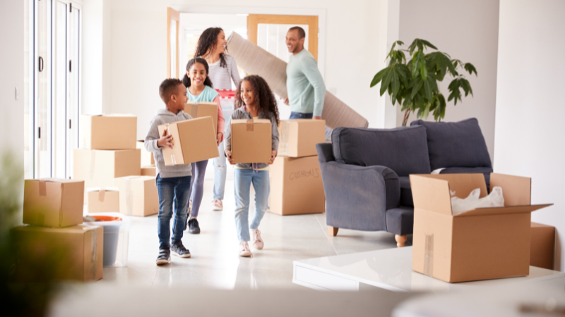 mixed race family moving into a new house