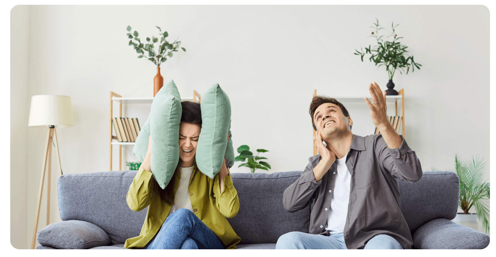 A man and woman disturbed by loud noises