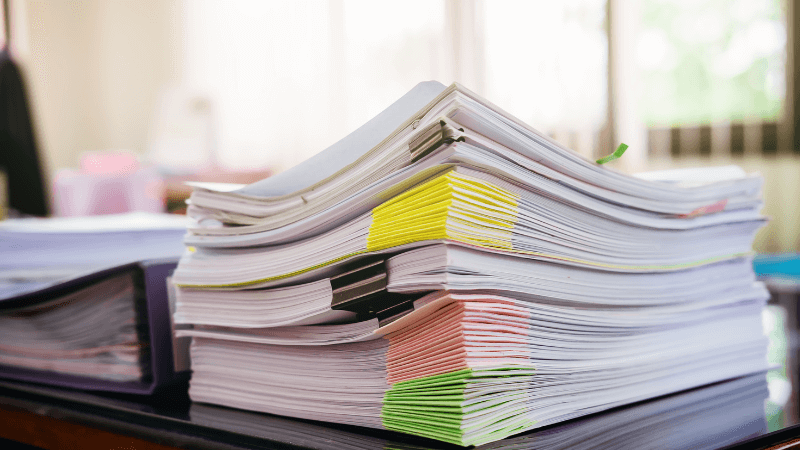 stack of documents on a desk