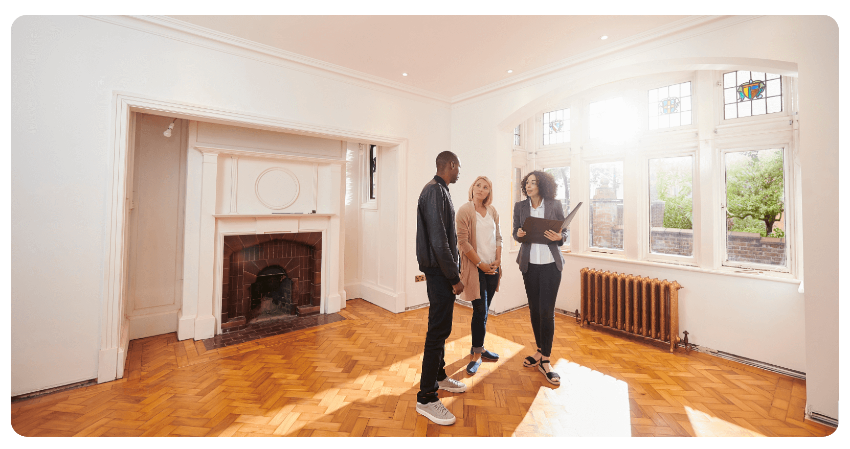 black man, white woman, and black woman in empty house, real estate