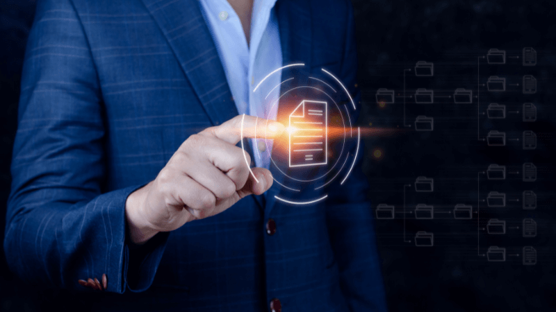 man in suit touching digital doc icon