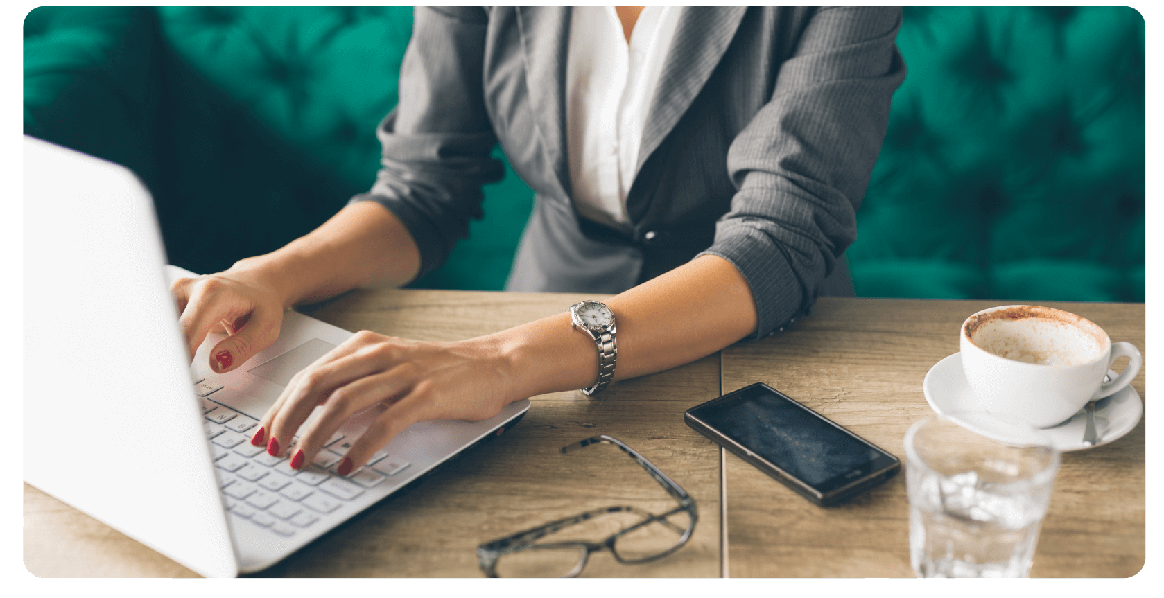 business woman in coffee shop using laptop