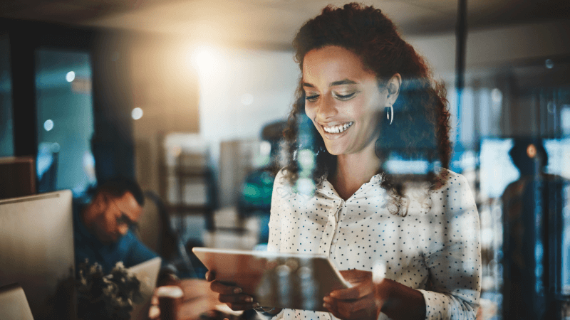 mixed race lady with an iPad